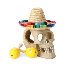 Photo of Human scull with Mexican sombrero hat and maracas isolated on white