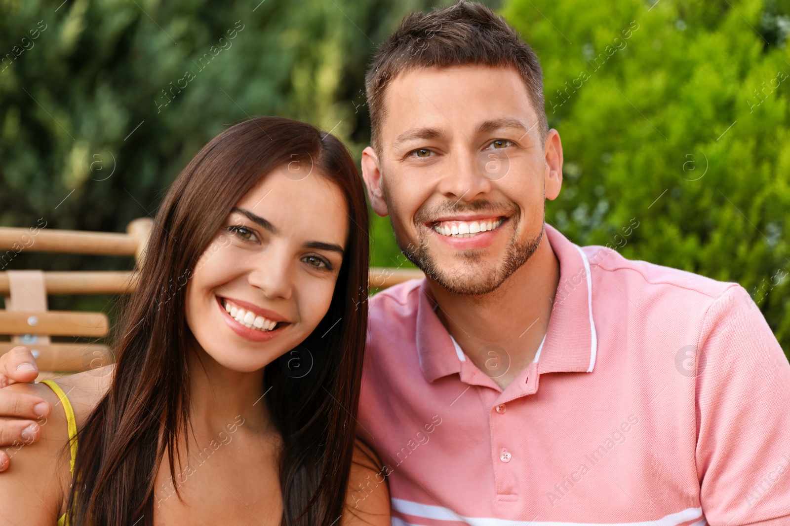 Image of Portrait of happy couple resting together outdoors