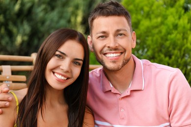 Image of Portrait of happy couple resting together outdoors