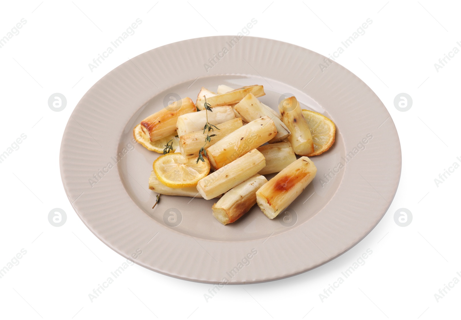 Photo of Plate with baked salsify roots, lemon and thyme isolated on white