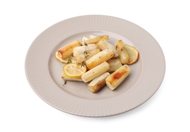 Photo of Plate with baked salsify roots, lemon and thyme isolated on white