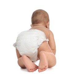 Photo of Cute little baby in diaper crawling on white background, back view