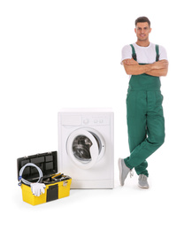 Photo of Repairman with toolbox near washing machine on white background