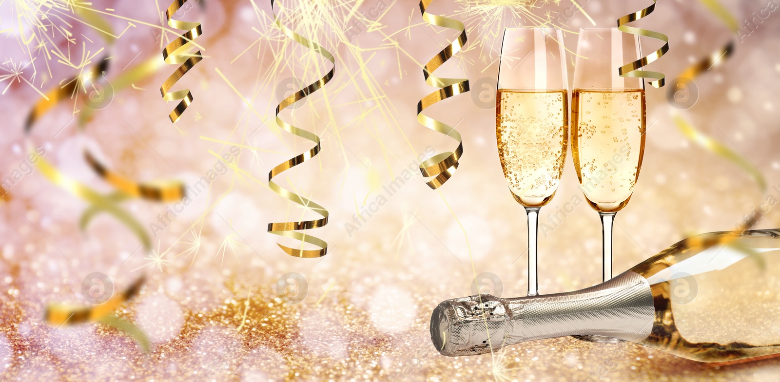 Image of Glasses and bottle of sparkling wine on bright festive background, banner design