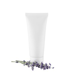 Tube of hand cream and lavender on white background
