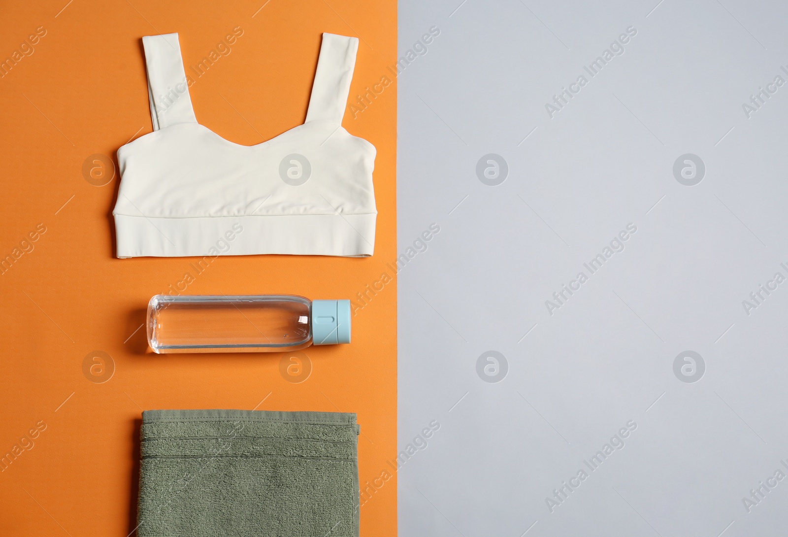 Photo of Flat lay composition with yoga equipment on grey background. Space for text