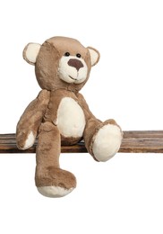 Photo of Cute teddy bear on wooden table against white background