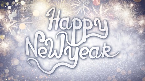 Text Happy New Year on festive background with fireworks, bokeh effect