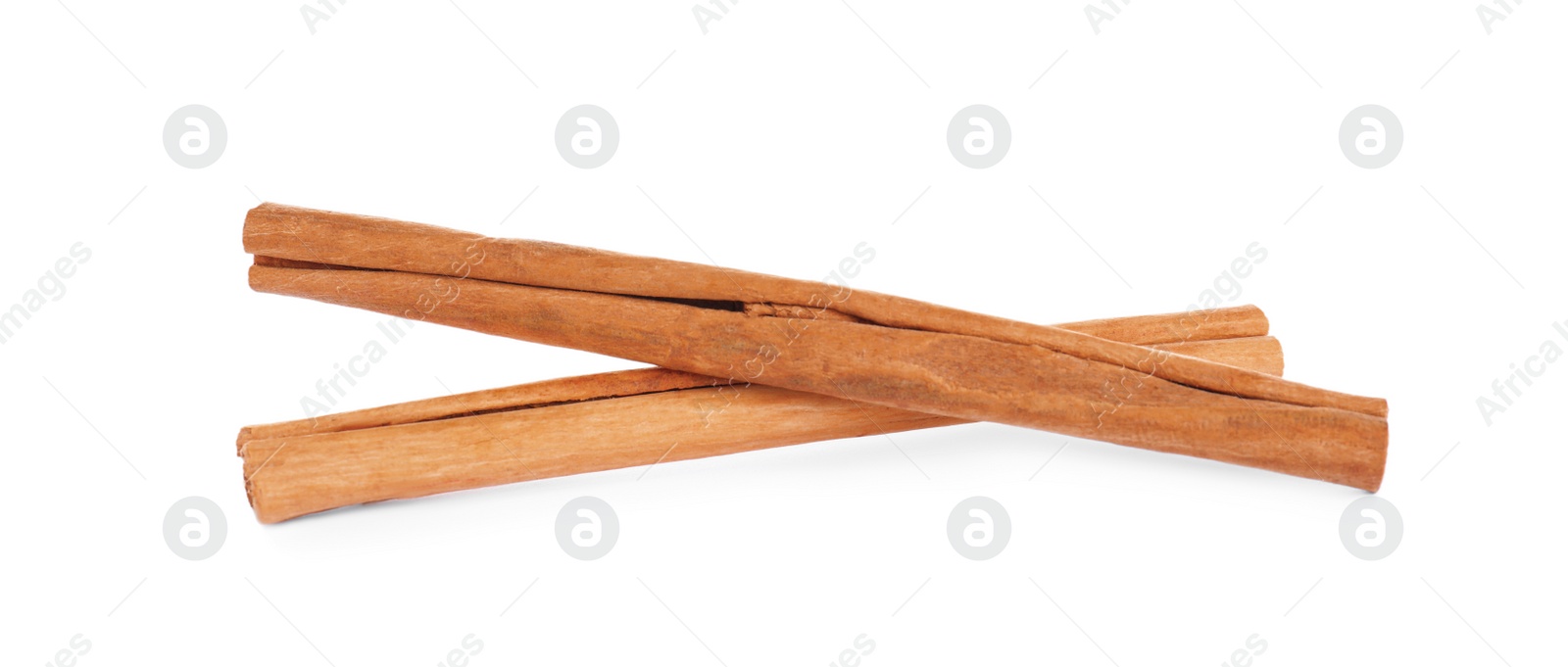 Photo of Aromatic brown cinnamon sticks on white background