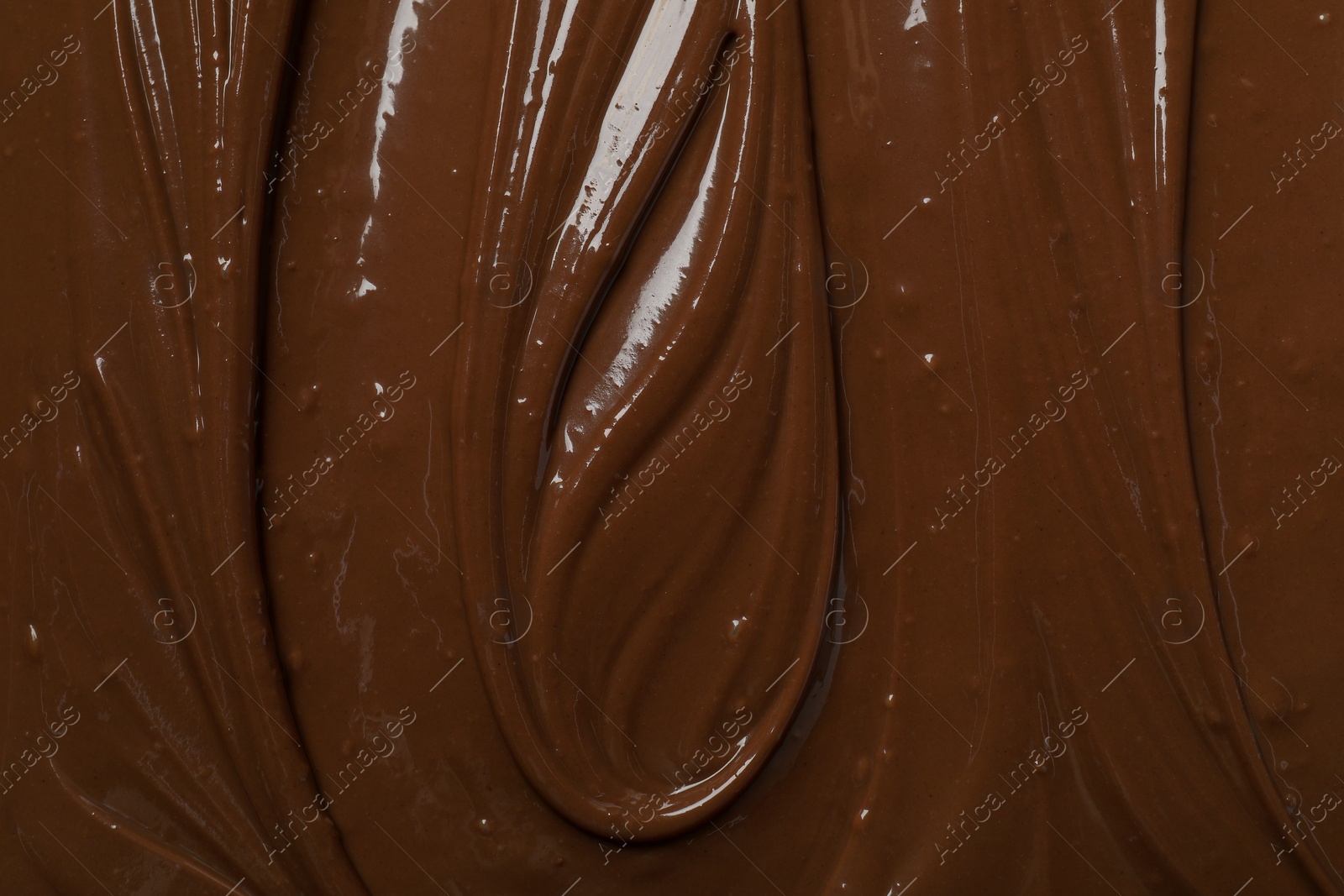 Photo of Tasty milk chocolate paste as background, top view