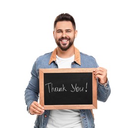 Photo of Happy man holding small chalkboard with phrase Thank You on white background