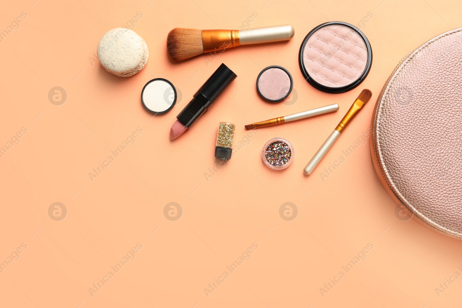 Photo of Makeup products with cosmetic bag on color background