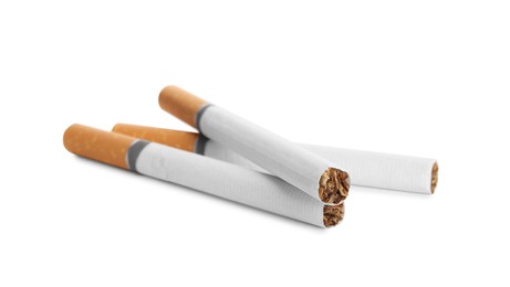 Cigarettes with orange filters isolated on white