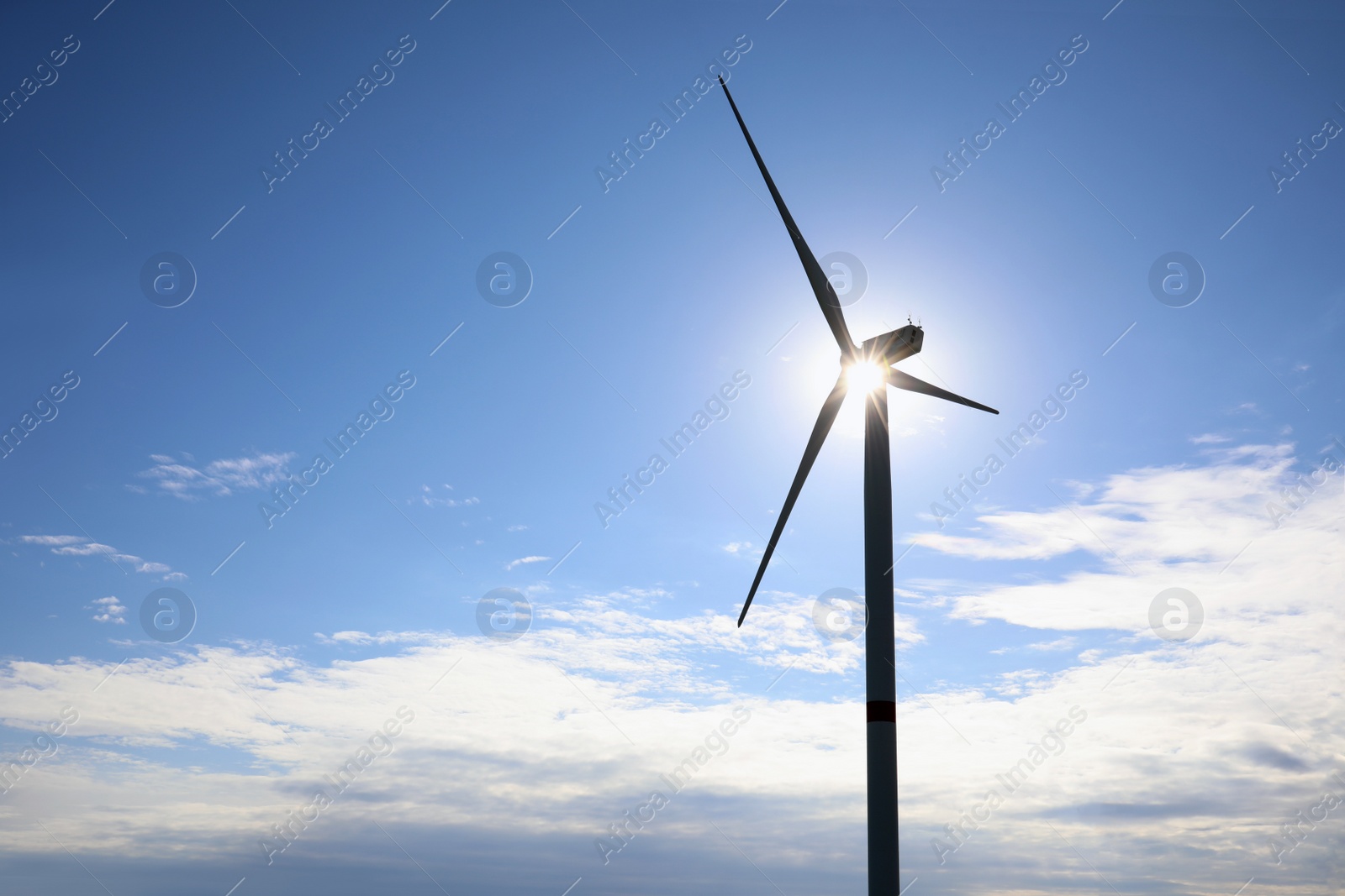Photo of Wind turbines against beautiful blue sky. Alternative energy source