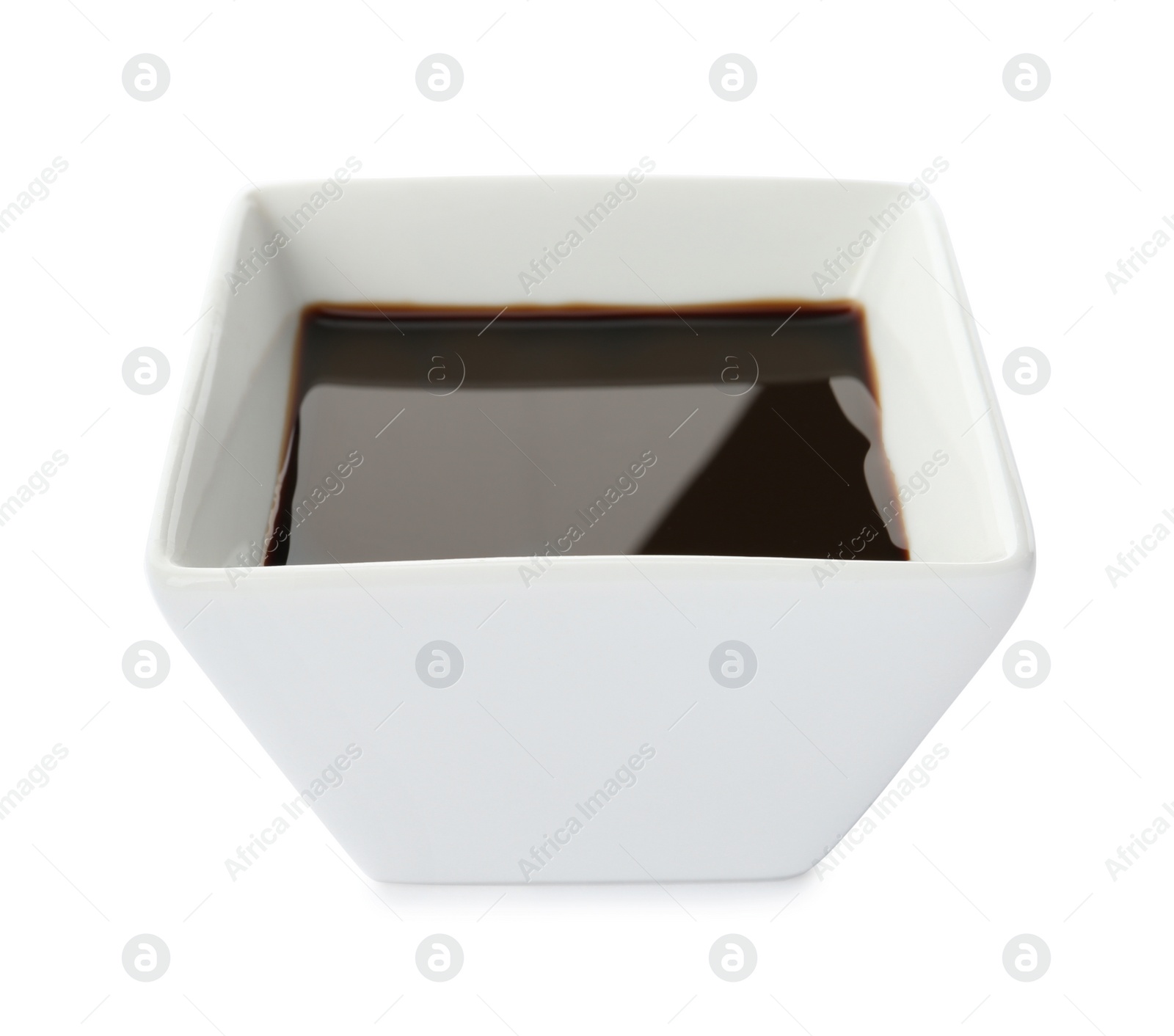 Photo of Dish of soy sauce on white background