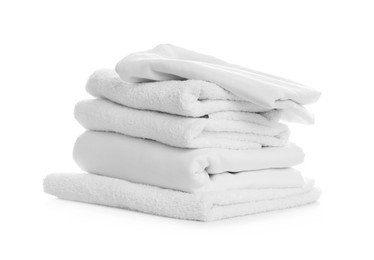 Photo of Stack of towels and bedding on white background