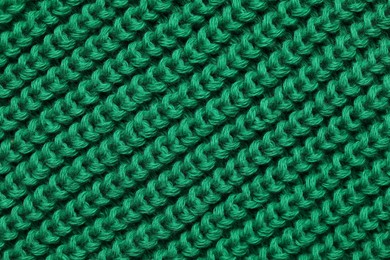 Texture of soft green fabric as background, top view