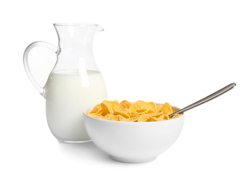 Photo of Milk and corn flakes on white background