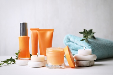 Composition with cosmetic products on white table