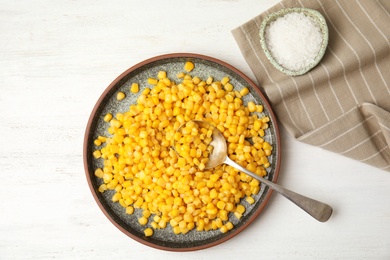 Photo of Flat lay composition with corn kernels on white wooden background