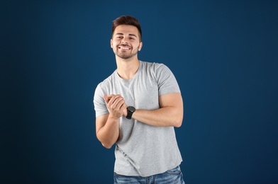 Photo of Portrait of handsome man on color background