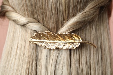 Woman with beautiful gold hair clip, closeup