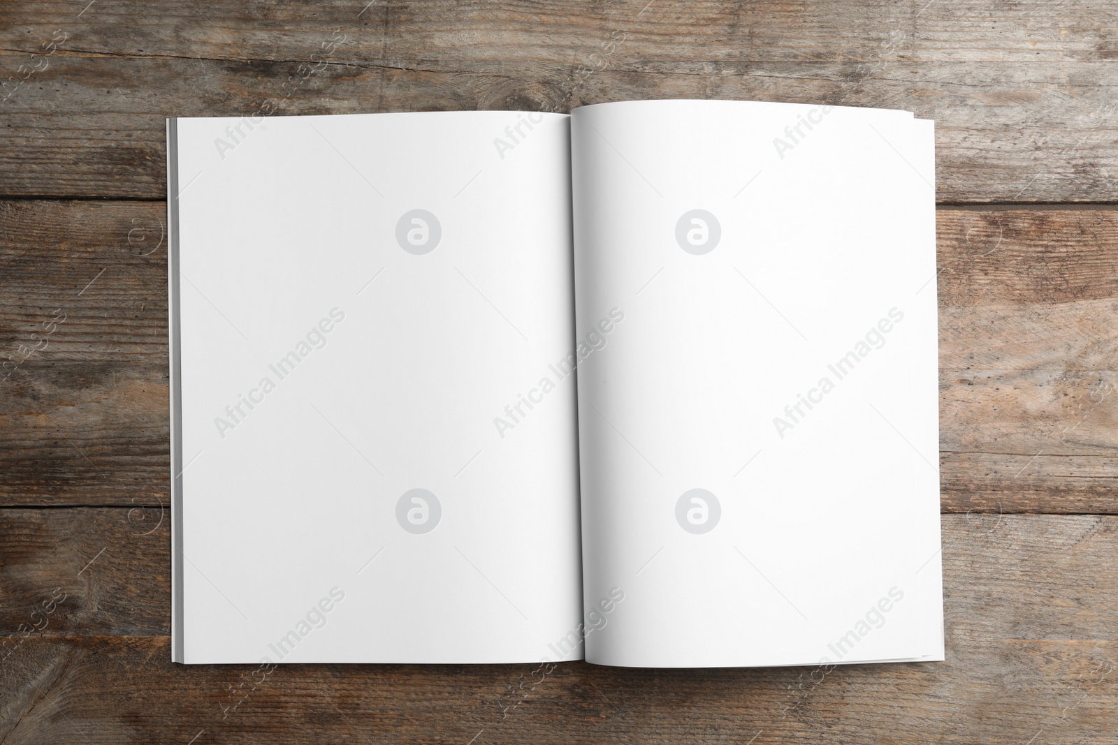 Photo of Mockup of open brochure on wooden background, top view