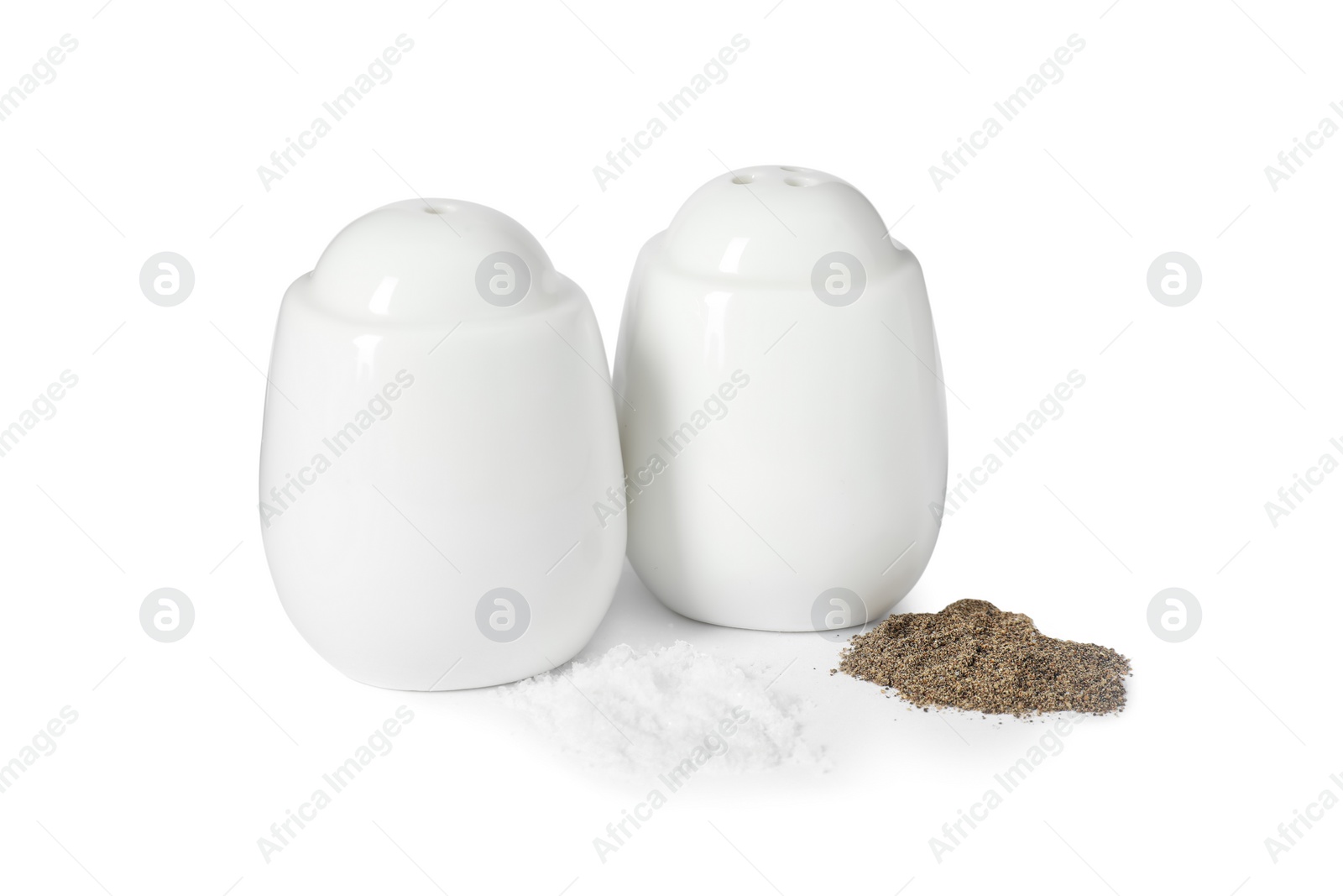 Photo of Two shakers with pepper and salt isolated on white