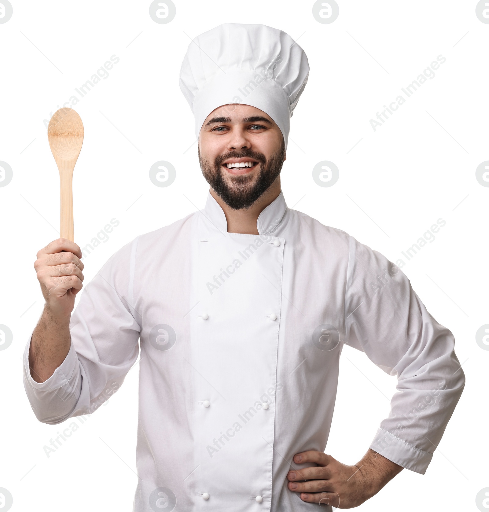 Photo of Happy young chef in uniform holding wooden spoon on white background