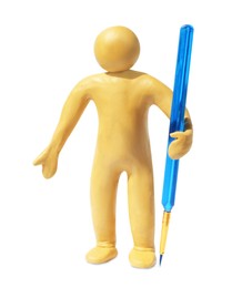 Human figure made of yellow plasticine holding paintbrush isolated on white