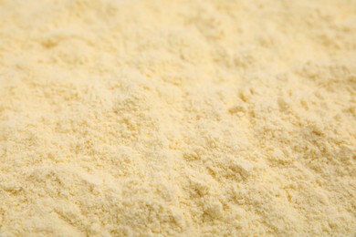 Photo of Pile of corn flour as background, closeup