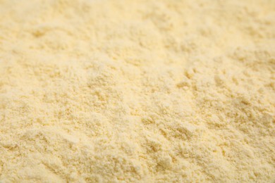 Pile of corn flour as background, closeup