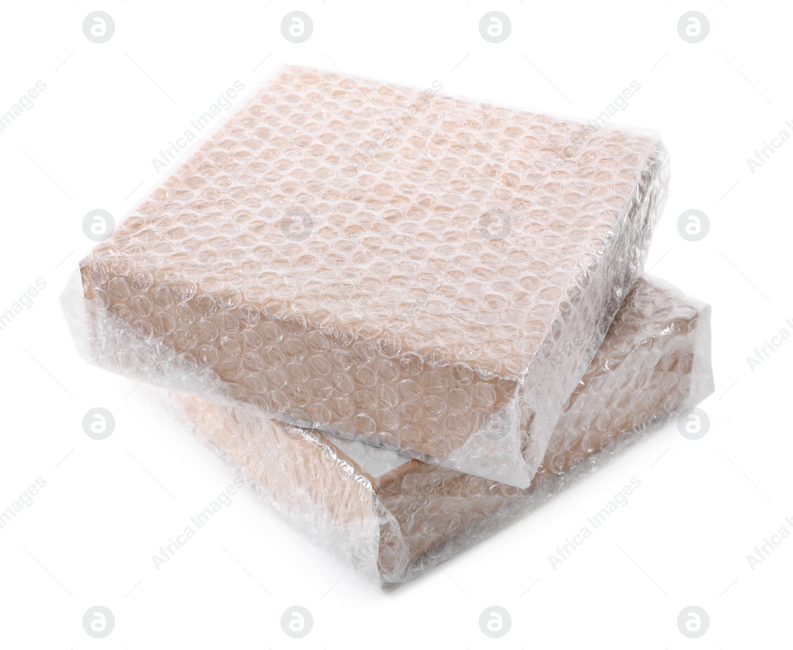Photo of Cardboard boxes packed in bubble wrap on white background