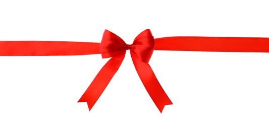 Photo of Red ribbon with bow on white background. Festive decoration