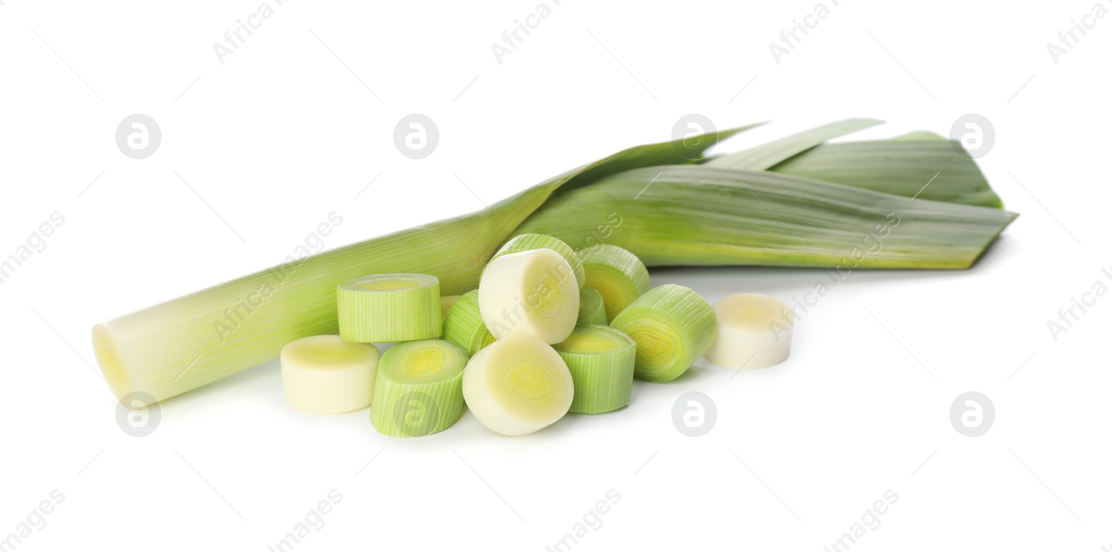 Photo of Whole and cut fresh leeks on white background