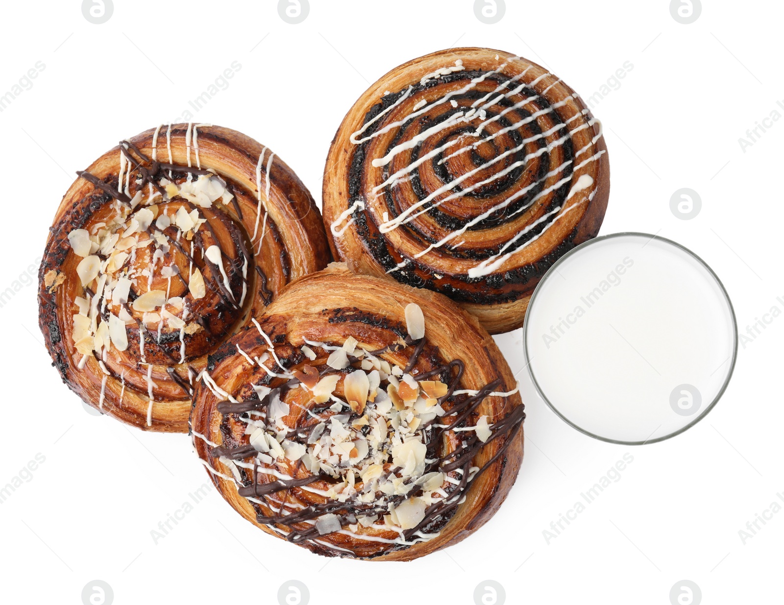 Photo of Different delicious rolls and milk in glass isolated on white, top view. Sweet buns