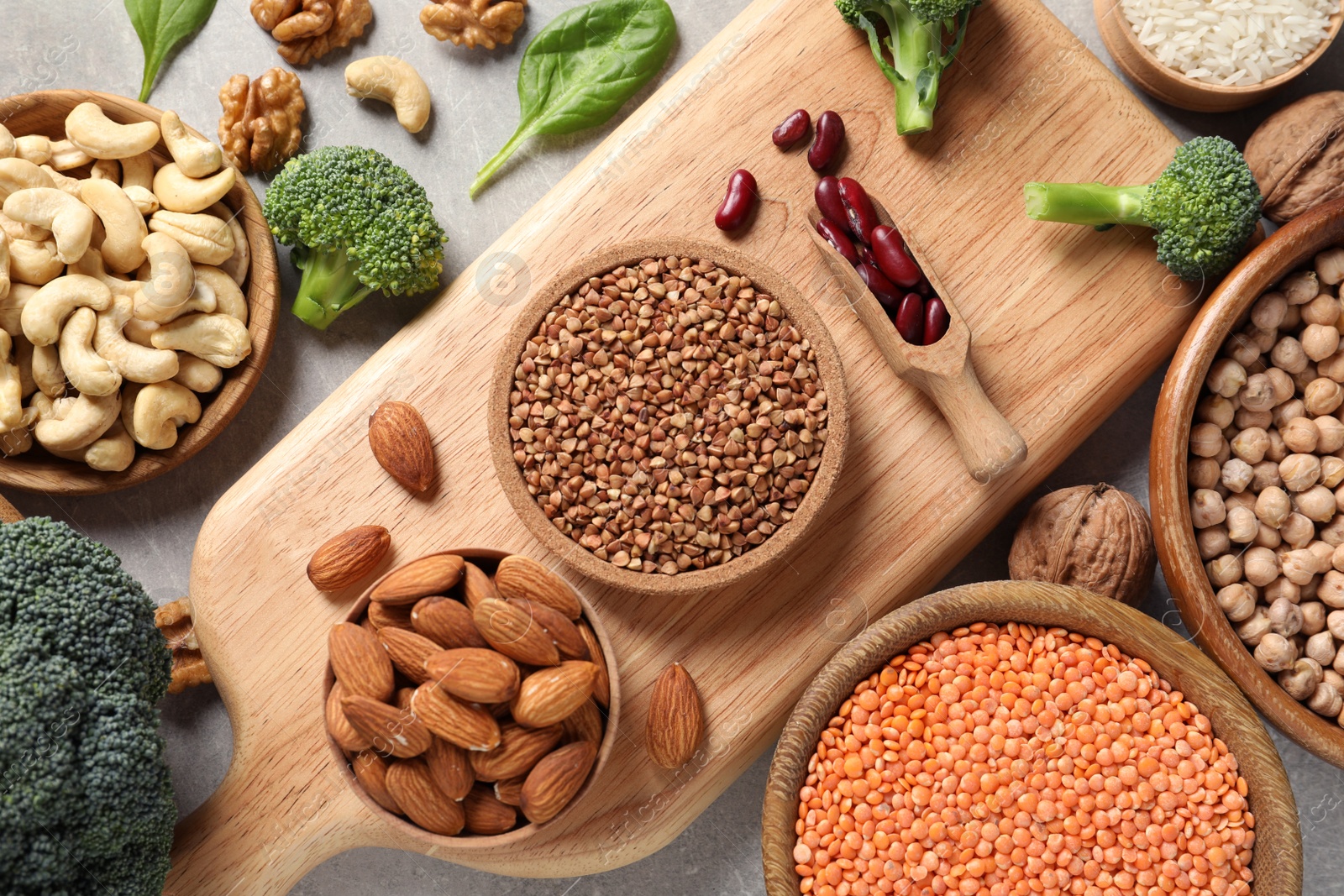 Photo of Set of natural food high in protein on grey background, top view