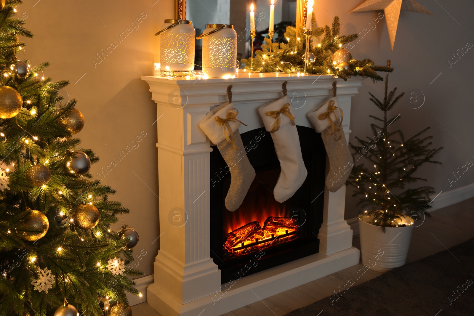 Photo of Beautiful living room interior with burning fireplace. Christmas celebration