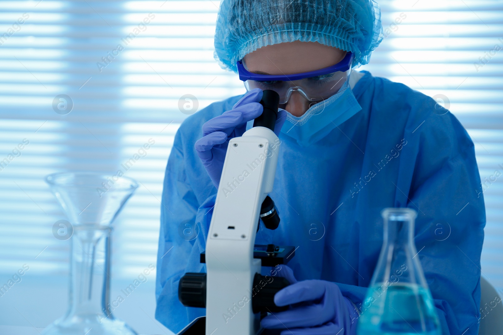 Photo of Scientist working with microscope in laboratory. Medical research