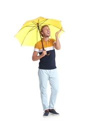 Photo of Man with yellow umbrella on white background