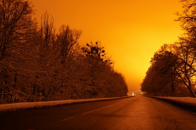 Photo of Beautiful view of twilight over country road. Winter landscape