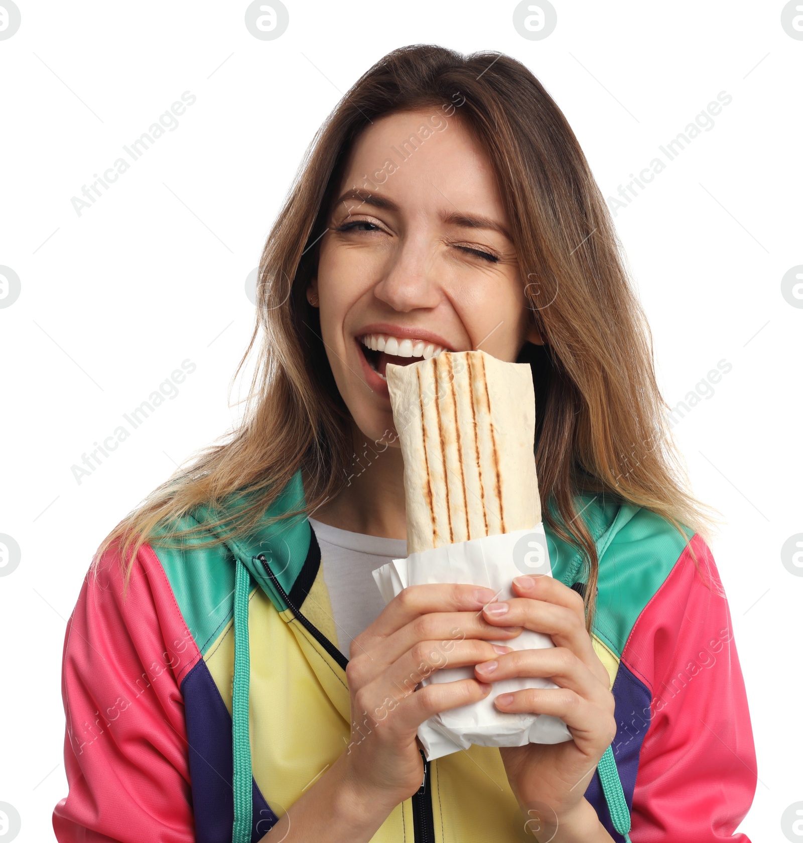 Photo of Young woman eating delicious shawarma on white background