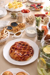 Variety of snacks on wooden table in buffet style