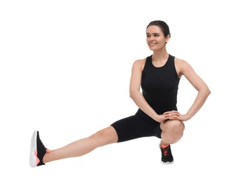Photo of Happy woman stretching on white background. Morning exercise