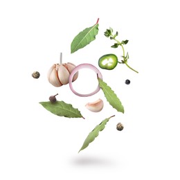 Image of Bay leaves, garlic, onion ring, thyme, black and fresh green peppers falling on white background