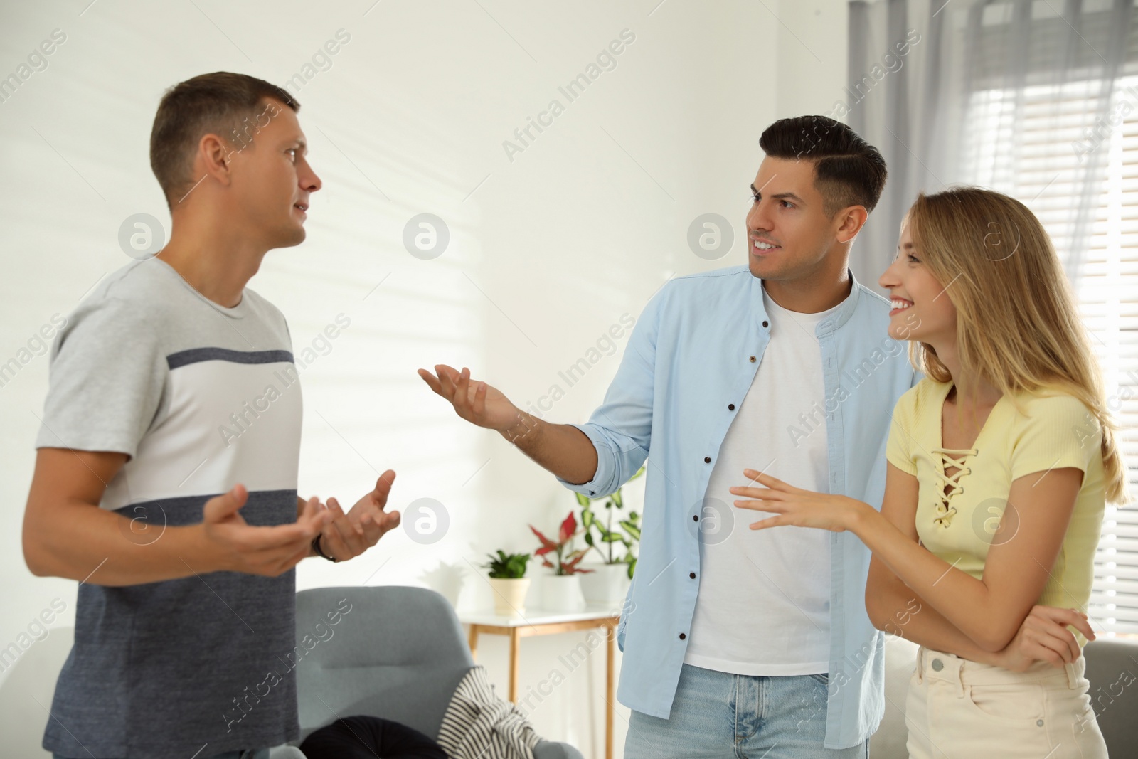 Photo of Group of people talking in living room