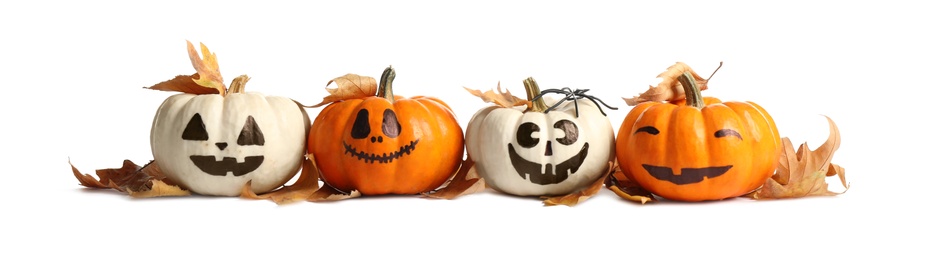 Photo of Cute Halloween pumpkins and autumn leaves on white background