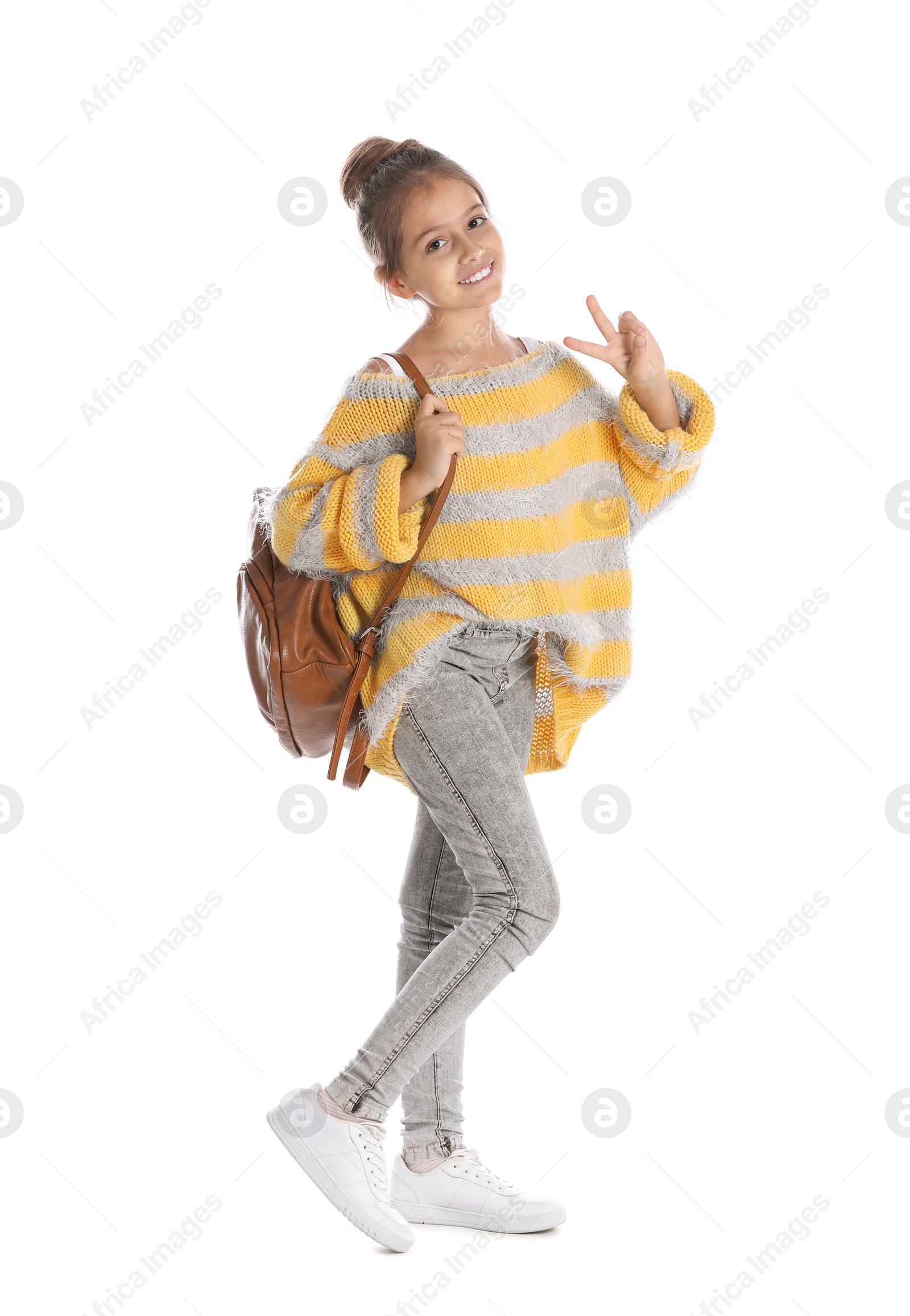 Photo of Pretty preteen girl with backpack against white background