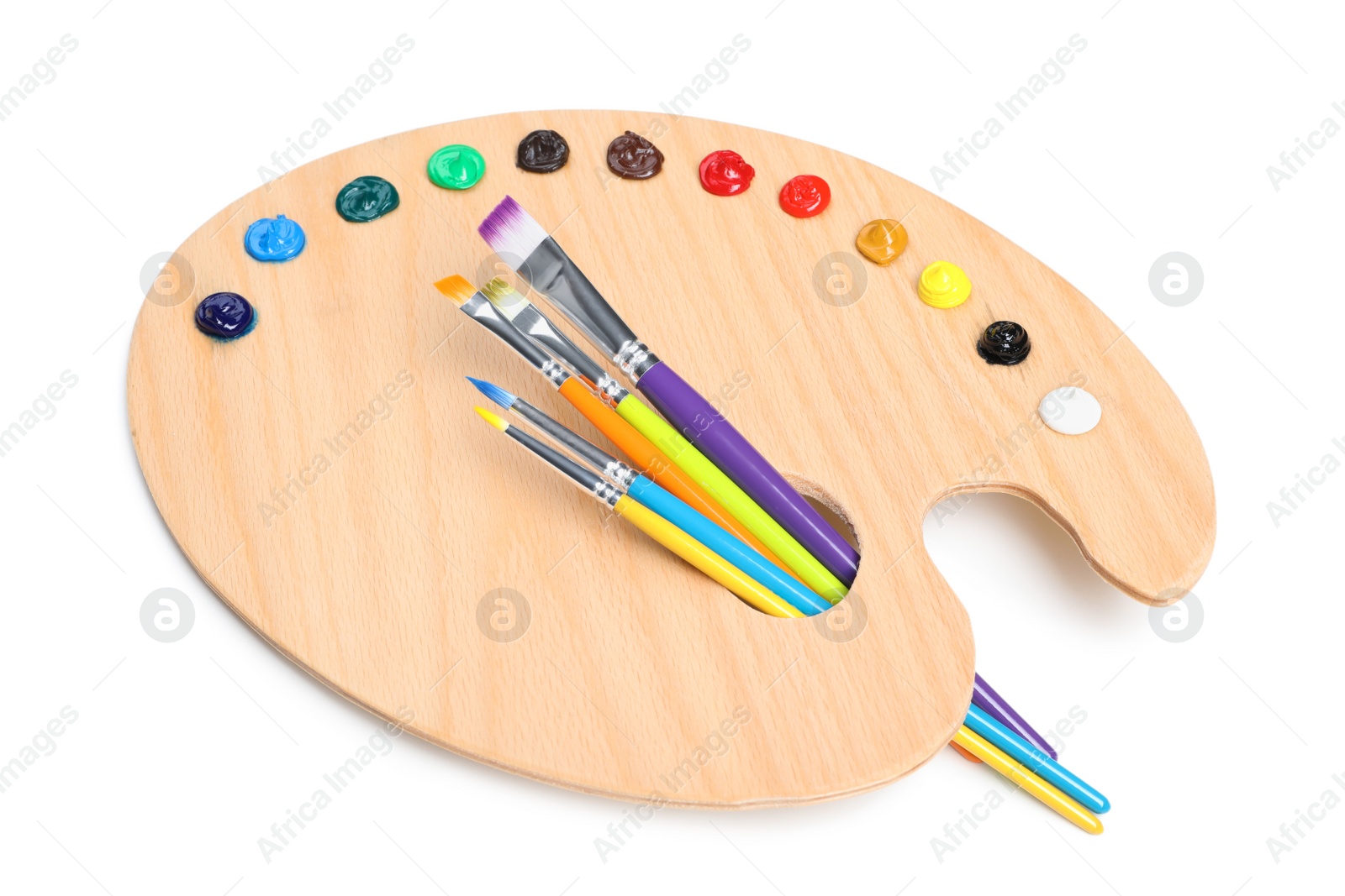 Photo of Palette with paints and brushes on white background. Artist equipment