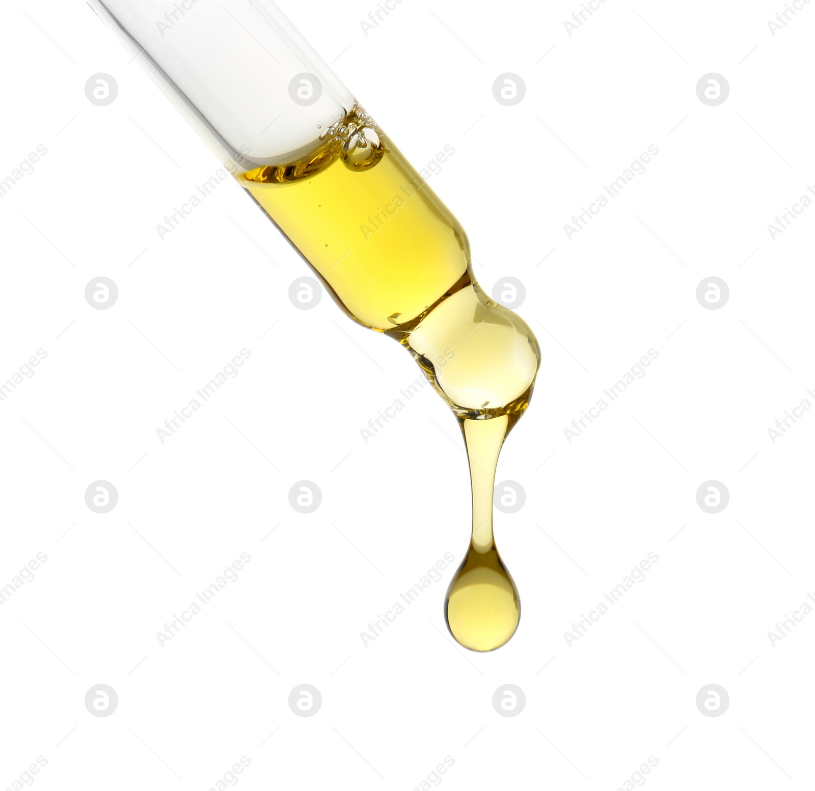 Photo of Dripping tincture from pipette isolated on white